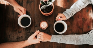 Couple talking over a coffee